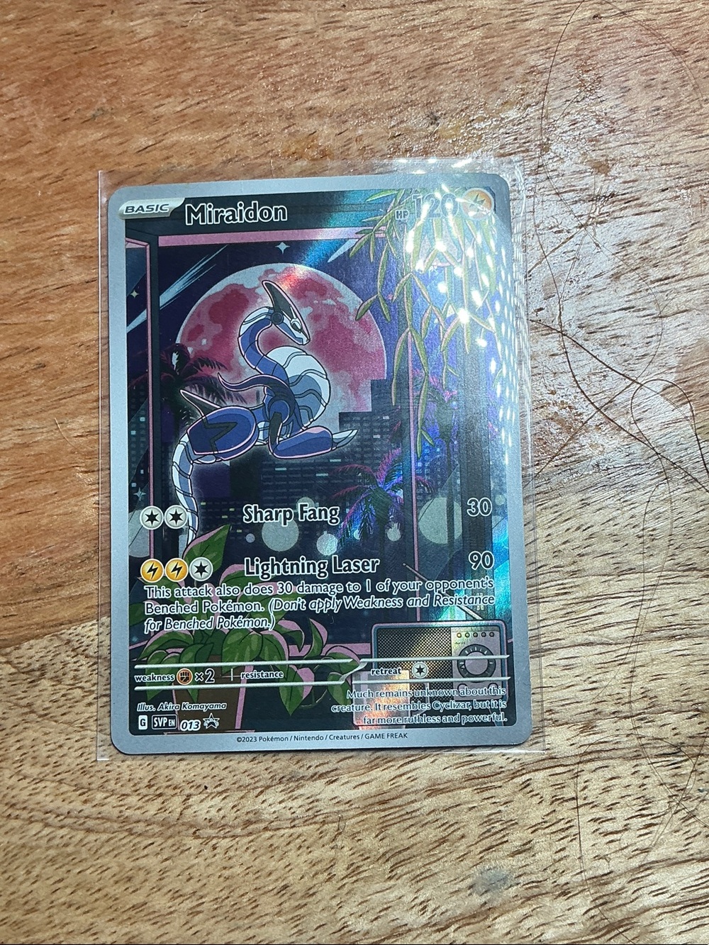 Miraidon Pokémon Holo Card - Blue, Pink, Silver Accents